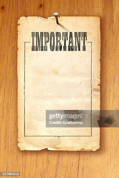 brown paper fixed with nail on wooden background saying "important" - wanted poster background stock pictures, royalty-free photos & images