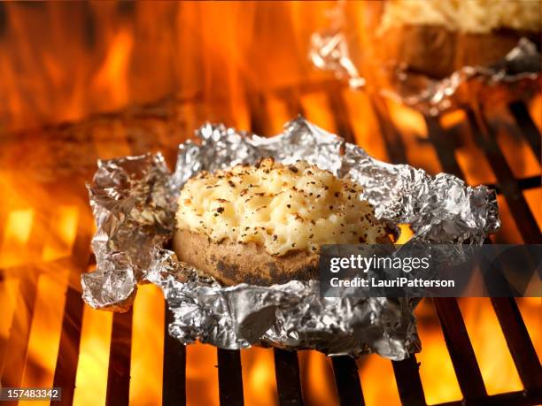 stuffed potatoes on the bbq - prepared potato stock pictures, royalty-free photos & images