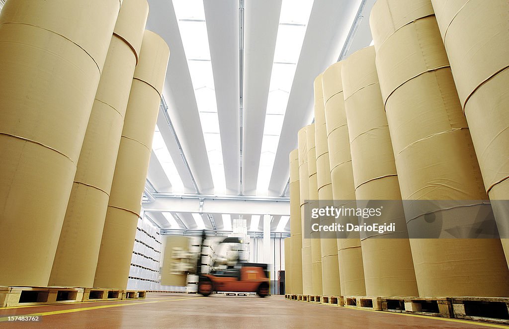 Huge spools of paper in warehouse of a printing company