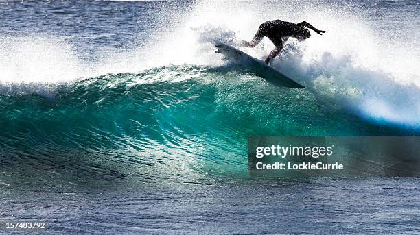 a surfer tries to stay on the surfboard while riding a wave - margaret river australia stock pictures, royalty-free photos & images