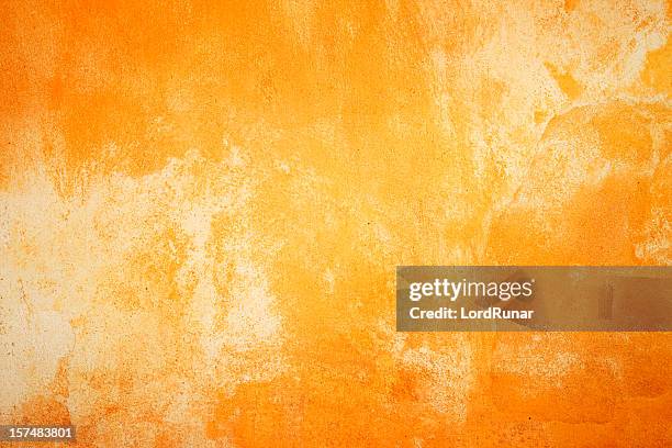 ardientes textura de pared - orange colour fotografías e imágenes de stock