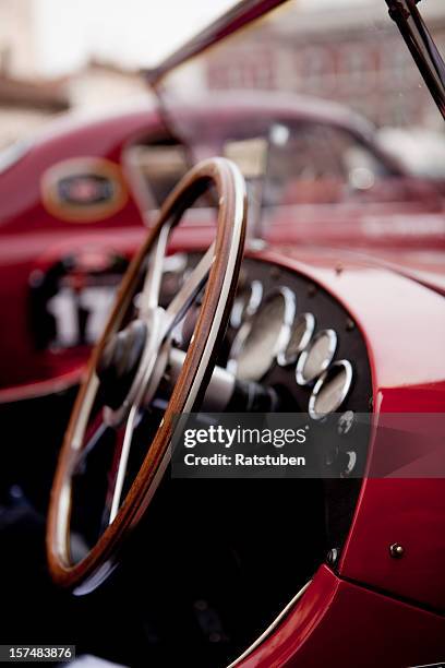close up of steering wheel on red classic car - vintage car rally stock pictures, royalty-free photos & images