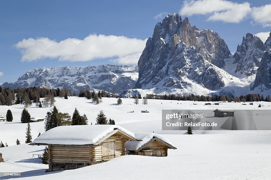 Winter landscape with shed and Langkofel mountain in Dolomites, Italy