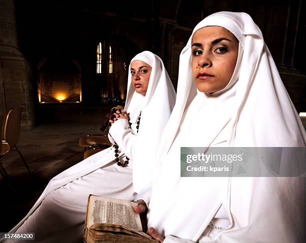 nuns in church - nun stock pictures, royalty-free photos & images