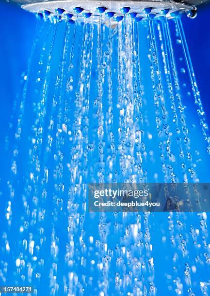 running shower in bath - blauer hintergrund stock pictures, royalty-free photos & images