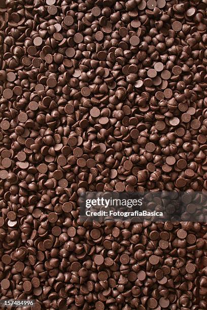 chocolate chips background - chocolate chip stock pictures, royalty-free photos & images