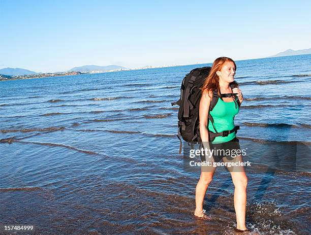 backpacking woman on the move - sabbatical stockfoto's en -beelden