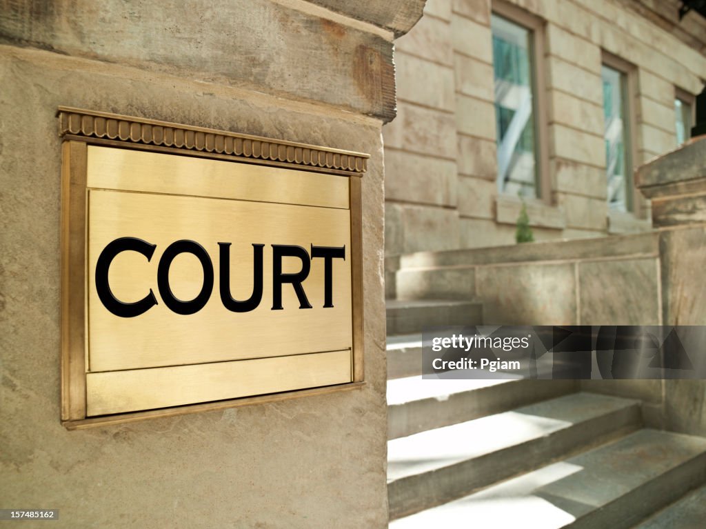 Bronze court plaque on an important building