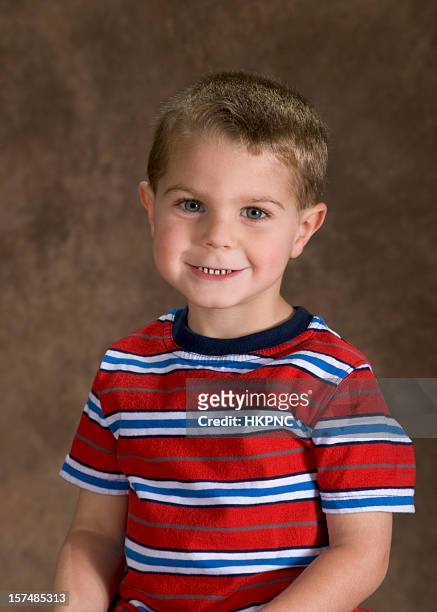 preschool boy sitting for his school picture, cute pose - skolfoto bildbanksfoton och bilder