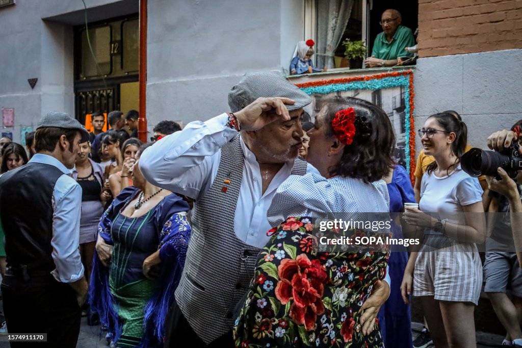 A couple of chulapos dance a "chotis" on Calle del Oso for...