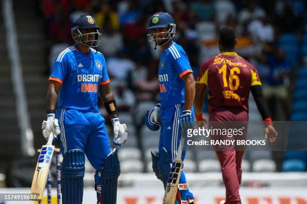 Suryakumar Yadav and Tilak Varma of India partnership during the first T20I match between West Indies and India at Brian Lara Cricket Academy in...
