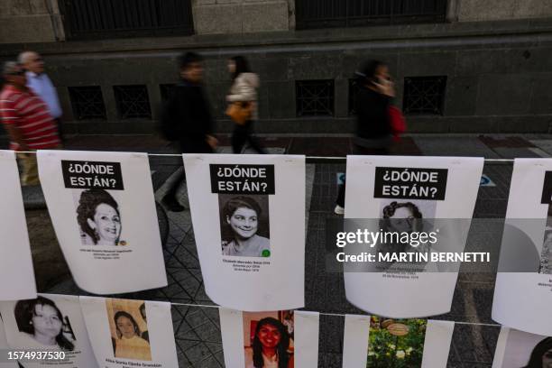 Pictures of women who disappeared and were politically executed during Augusto Pinochet's dictatorship hang in a memorial installed by the Chilean...