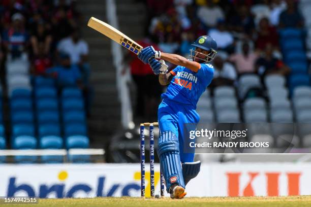 Tilak Varma of India hits 6 during the first T20I match between West Indies and India at Brian Lara Cricket Academy in Tarouba, Trinidad and Tobago,...