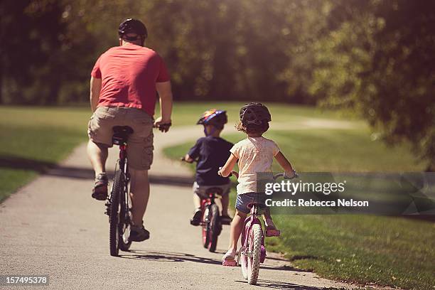 family bike ride - son daughter stock pictures, royalty-free photos & images