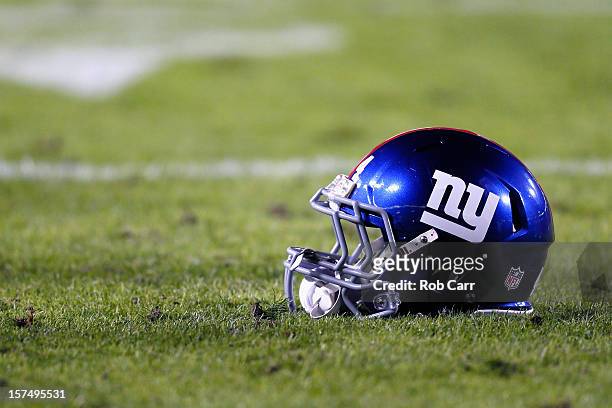 The helmet of running back Ahmad Bradshaw of the New York Giants sits on the grass before the start of the Giants and Washington Redskins game at...