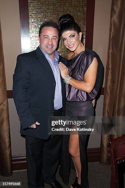Teresa Giudice and Joe Giudice attend the Posche Fashion show at The Bottagra on December 3, 2012 in Hawthorne, New Jersey.