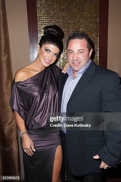 Teresa Giudice and Joe Giudice attend the Posche Fashion show at The Bottagra on December 3, 2012 in Hawthorne, New Jersey.