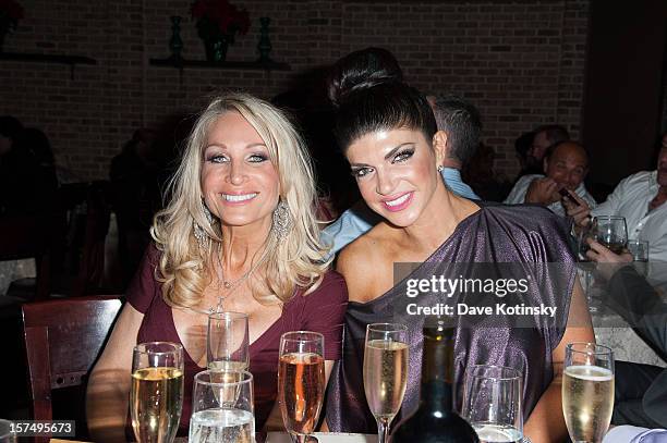 Teresa Giudice and Kim DePaola at the Posche Fashion Show at The Bottagra on December 3, 2012 in Hawthorne, New Jersey.