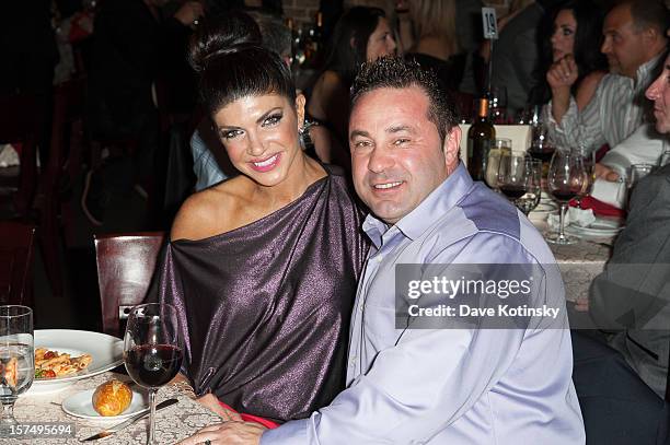 Teresa Giudice and Joe Giudice attend the Posche Fashion show at The Bottagra on December 3, 2012 in Hawthorne, New Jersey.