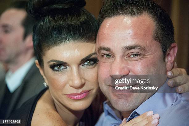 Teresa Giudice and Joe Giudice attend the Posche Fashion show at The Bottagra on December 3, 2012 in Hawthorne, New Jersey.