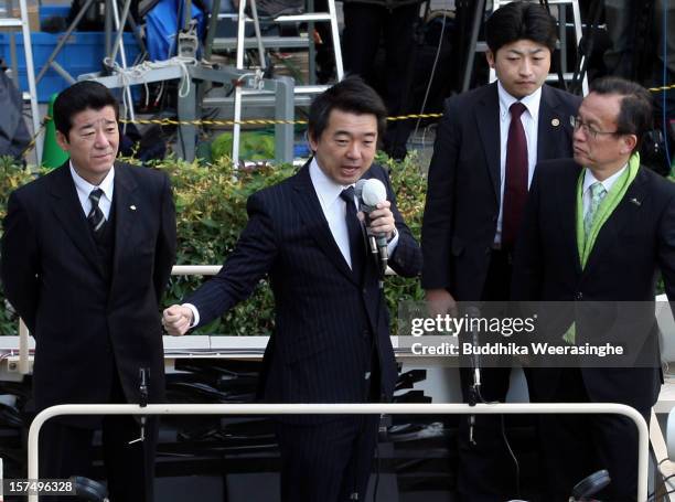 Japan Restoration Party deputy leader Osaka Mayor Toru Hashimoto speaks to voters during his official election party campaign for the upcoming lower...