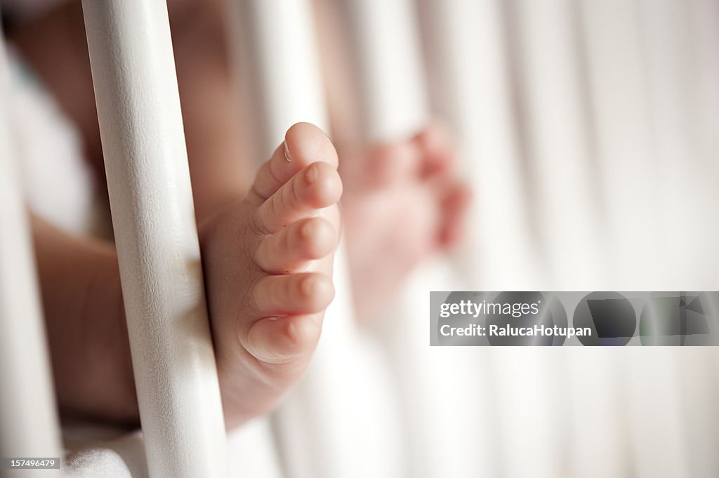 Baby's feet in the cradle
