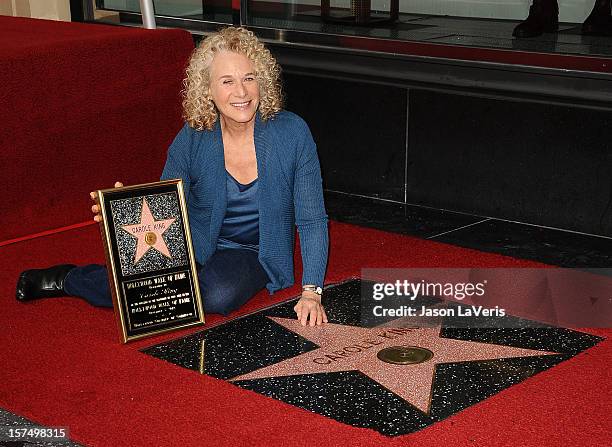 Carole King is honored with a star on the Hollywood Walk of Fame on December 3, 2012 in Hollywood, California.