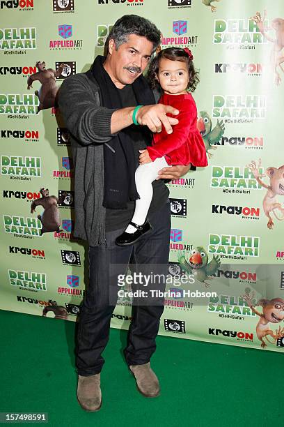 Esai Morales attends the Delhi Safari Los Angeles premiere with his daughter Mariana Oliveira Morales, at Pacific Theatre at The Grove on December 3,...