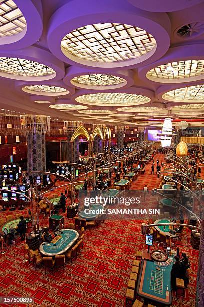 This general view shows the new tables at the Grand Lisboa hotel and casino during a press preview ahead of the casino's opening in Macau, 11...