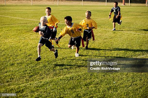 flag football action - rush american football stock pictures, royalty-free photos & images