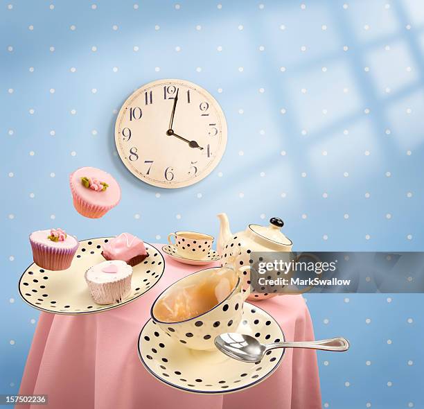 graphics of tea-time with mugs and cakes flying off table - tea time stock pictures, royalty-free photos & images