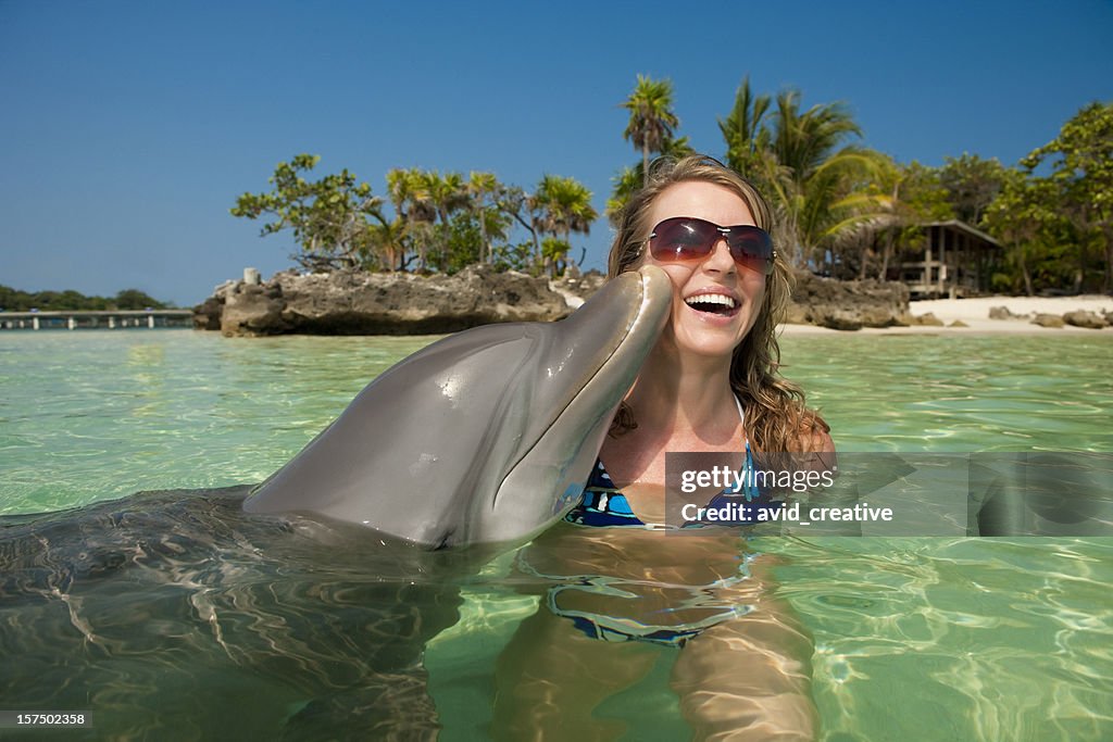 Vacation Lifestyles-Dolphin Kissing Woman's Cheek