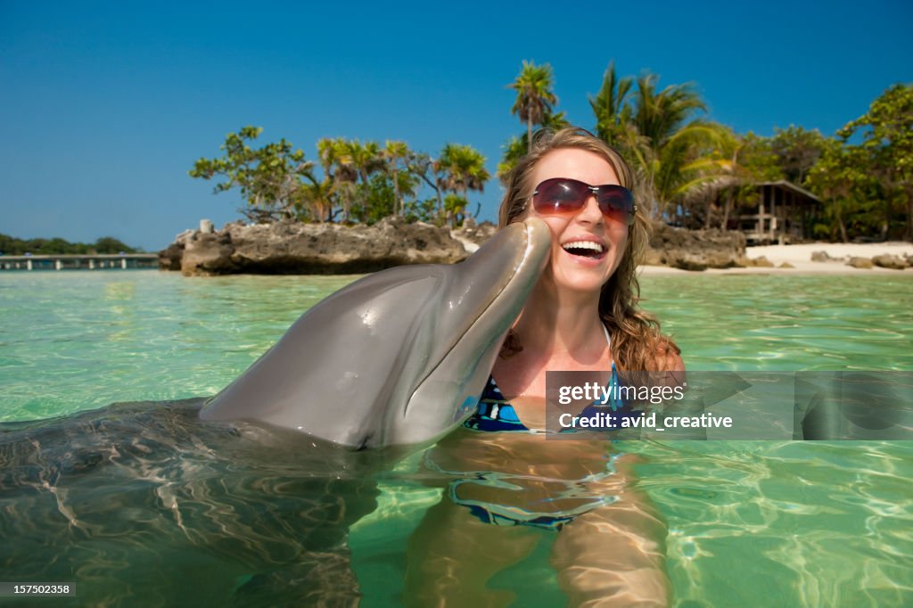 Vacation Lifestyles-Dolphin Kissing Woman's Cheek