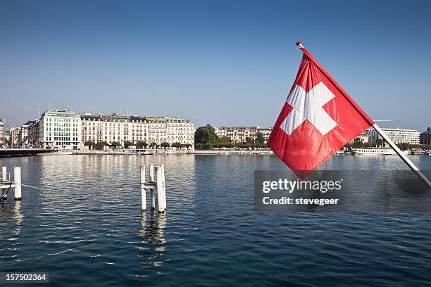 swiss flag and lake geneva - geneva switzerland stock pictures, royalty-free photos & images