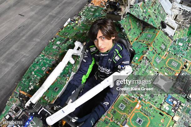 Aidan Gallagher inside the drivers seat of the Recover E Car, a full scale working model of a Formula E race car made entirely from electronic waste...