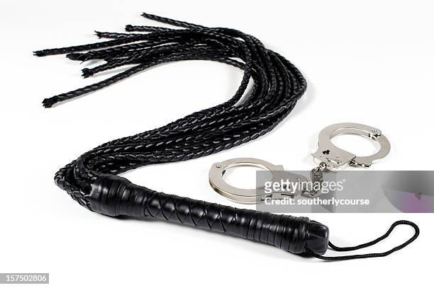 you better behave! whip and handcuffs. - fetisj stock pictures, royalty-free photos & images
