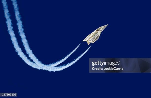 dollar shaped paper airplane flying up - spring savings stock pictures, royalty-free photos & images
