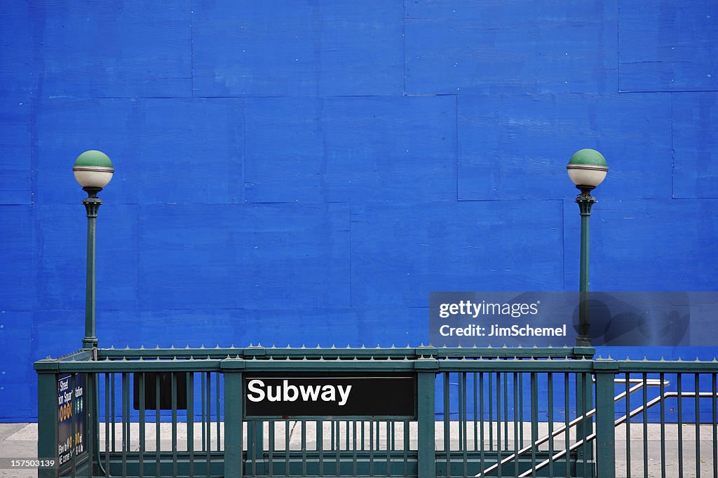 Subway entrance with green railing