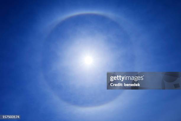 circular halo around the sun - troposphere stock pictures, royalty-free photos & images