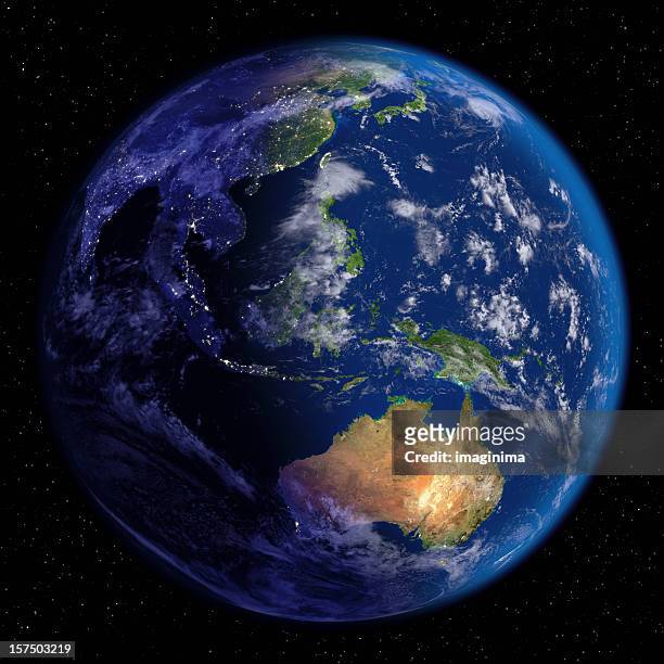 planet earth at night & día (lejano oriente y oceanía - océano pacífico fotografías e imágenes de stock