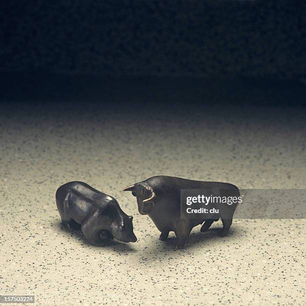 stock market: bull and bear - great recession stock pictures, royalty-free photos & images