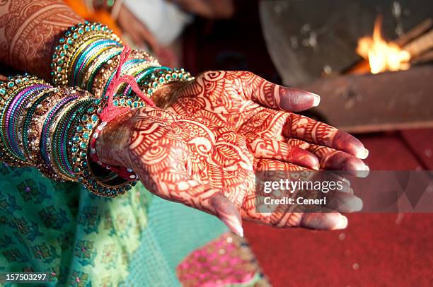 an indian bride with hands full of henna - henna tattoo stock pictures, royalty-free photos & images