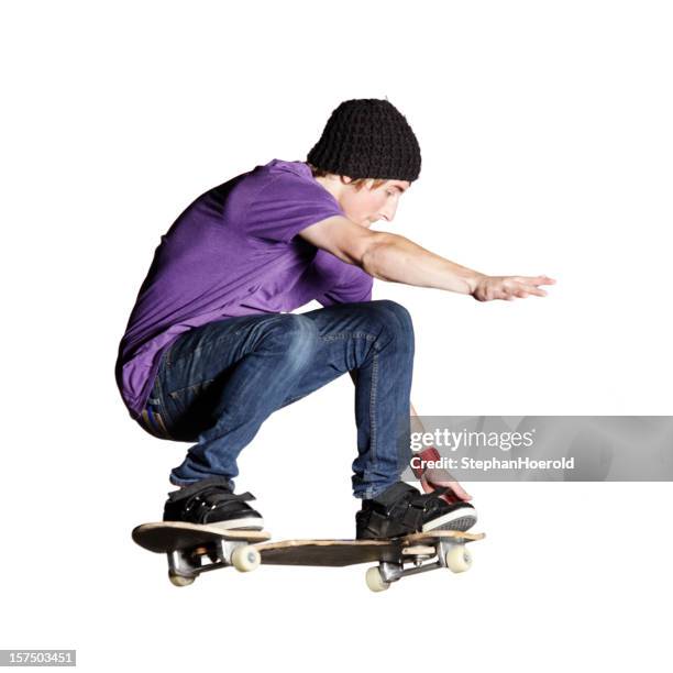artistic skateboarder caught mid-air, isolated on white - skater isolated stock pictures, royalty-free photos & images