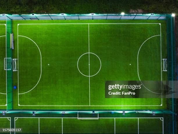 aerial view of mini football field at night - aerial football photos et images de collection