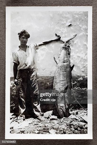 fisherman with bluefin tuna - catch of fish stock pictures, royalty-free photos & images