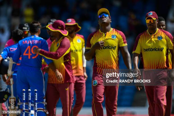 Rovman Powell of West Indies celebrates winning the first T20I match between West Indies and India at Brian Lara Cricket Academy in Tarouba, Trinidad...