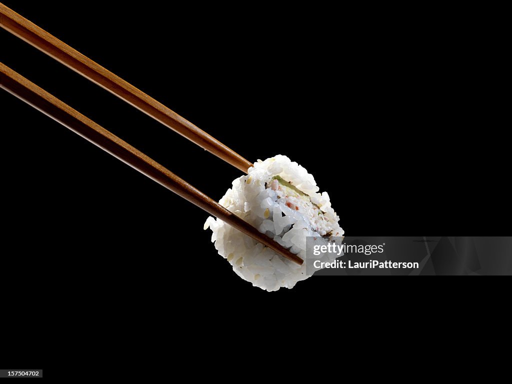 箸で寿司