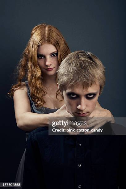 goth teenage girl choking boy - strangling stock pictures, royalty-free photos & images