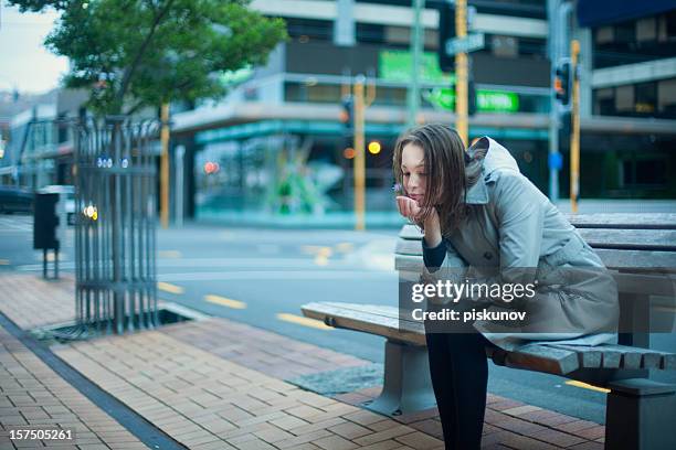 teen girl sitting on bench - homeless woman stock pictures, royalty-free photos & images