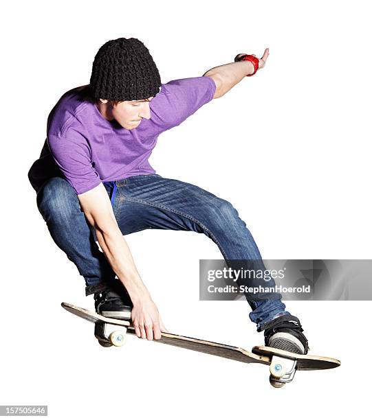 artistic skateboarder caught mid-air, isolated on white - skater isolated stock pictures, royalty-free photos & images